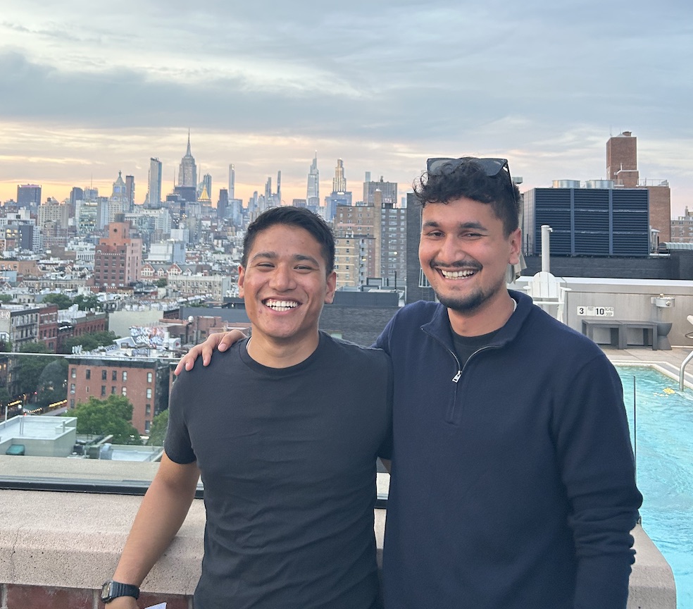 FanDeck founders smiling together with NYC skyline in background